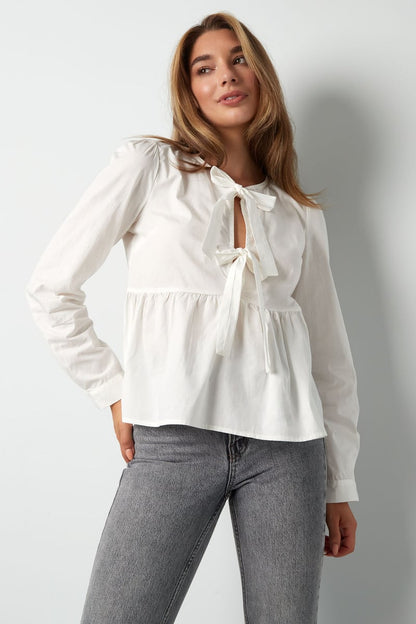 Longsleeve peplum top with bows